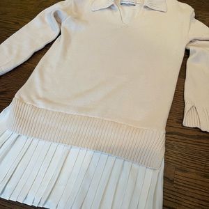 Cream sweater dress with white pleated detail